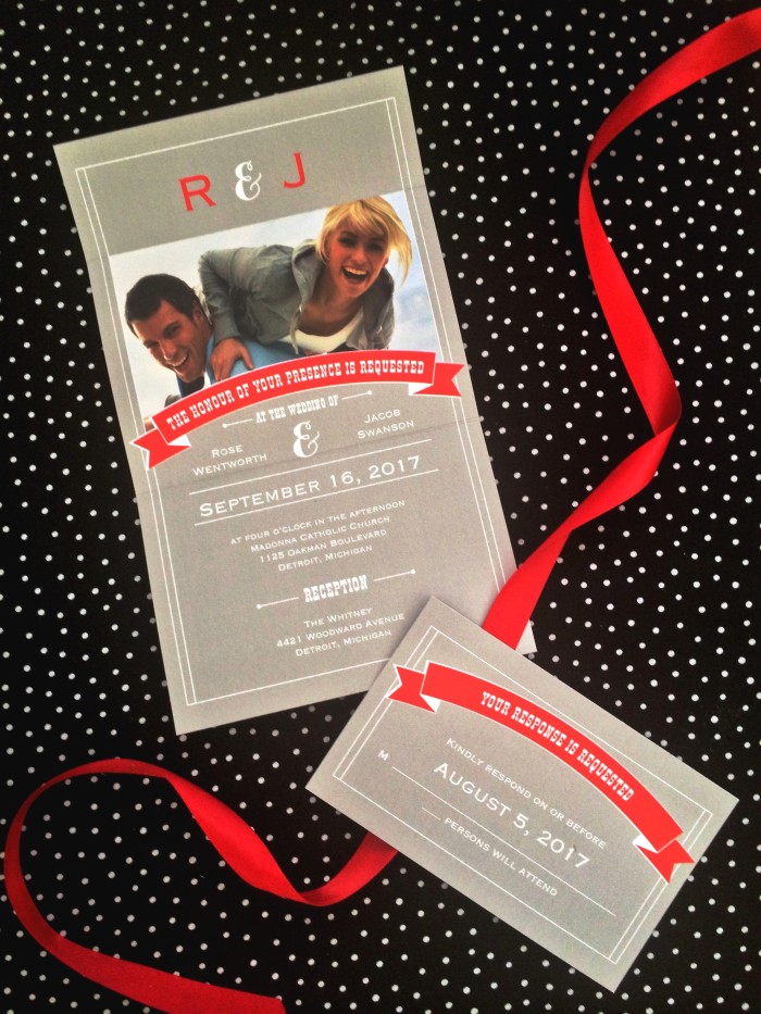 gray invitation with red ribbon