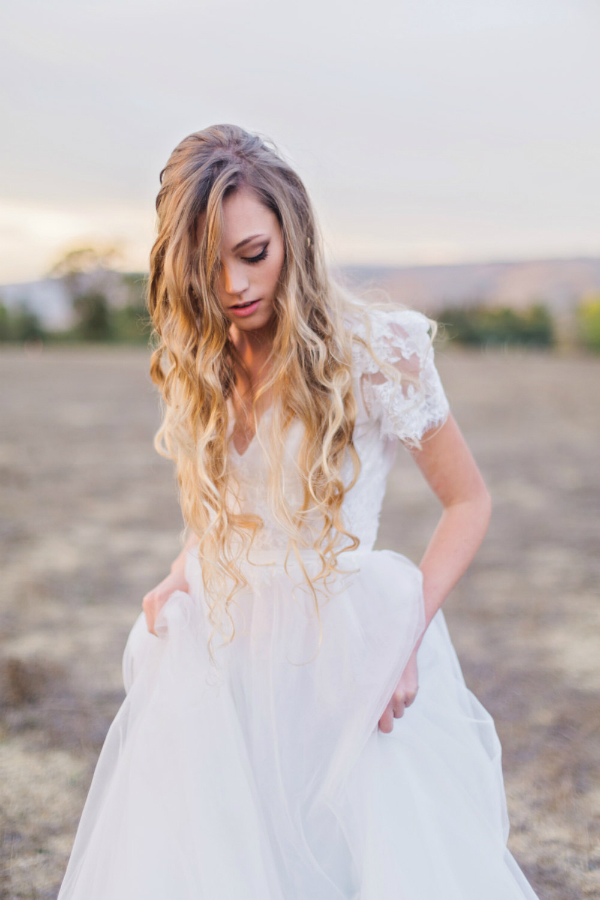 Gorgeous beach wedding dress with short sleeves by Flora and Lane