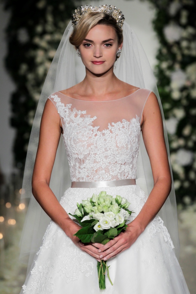 Cadogan Anne Barge Collection Bateau neckline and natural-waist ball gown with full skirt of tulle, adorned with Chantilly and Alençon lace appliqués.| Illusion neckline wedding dress and embellished detail | Anne Barge Fall 2016 Collection | Photo by Dan Lecca