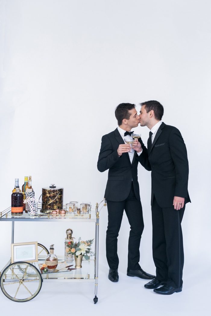 Bar cart toast and a kiss! Photography by AlexisJuneWeddings