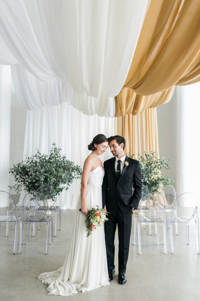 Aisle Society | Bride and groom under draping | Photographer ©Alexis June Weddings