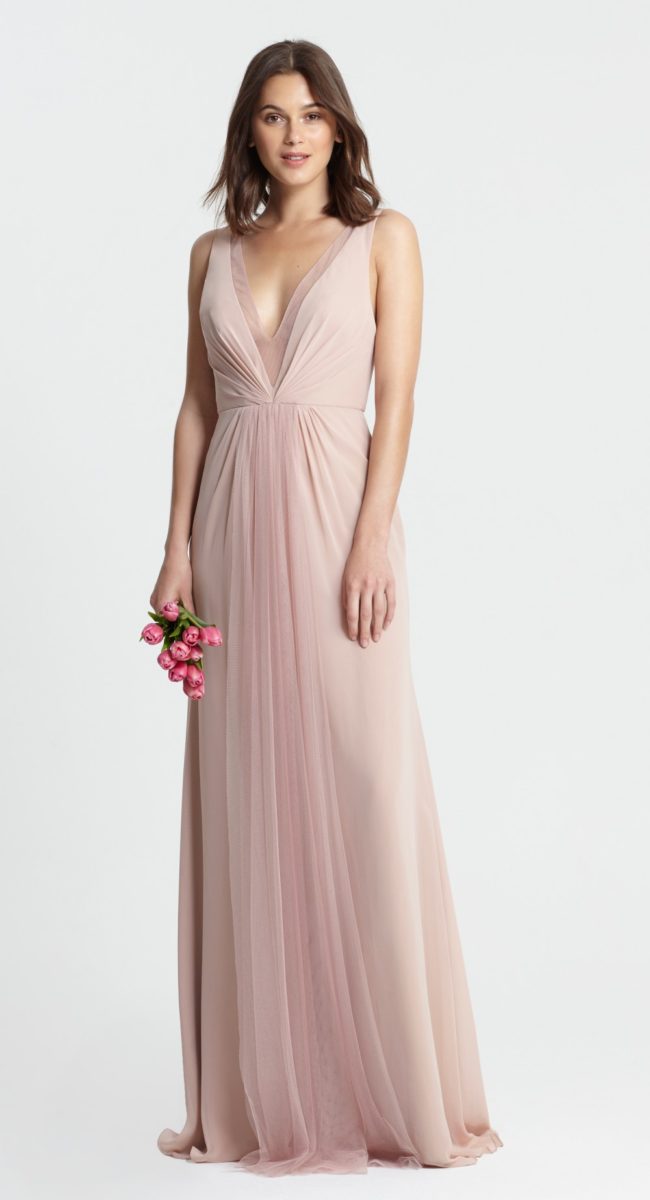 Shell pink bridesmaid dress with deep neckline by Monique Lhuillier