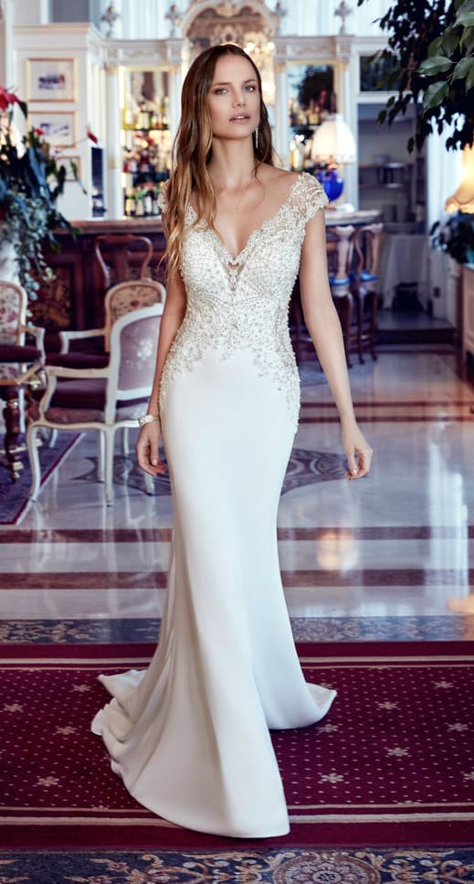 Beaded cap sleeve wedding dress by Eddy K