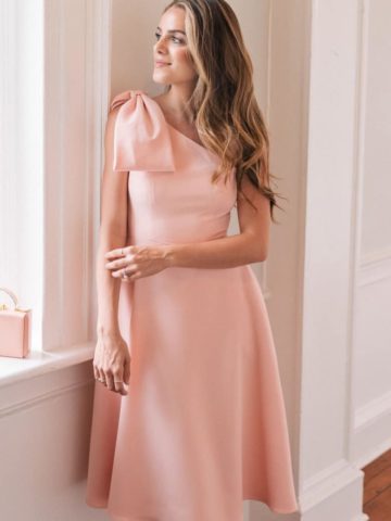 pink one shoulder dress for a wedding with bow