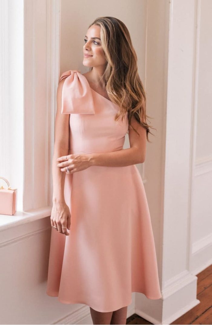 pink one shoulder dress for a wedding with bow 