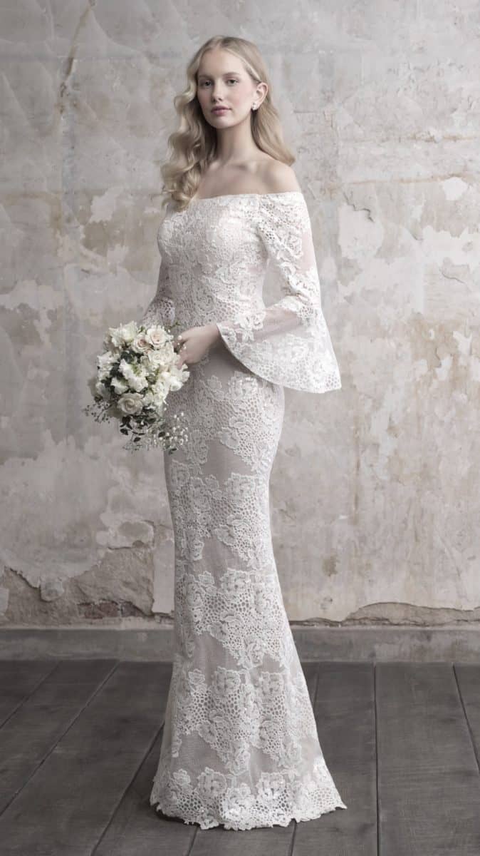 Lace wedding dress with unique off the shoulder style and bell sleeves by Madison James