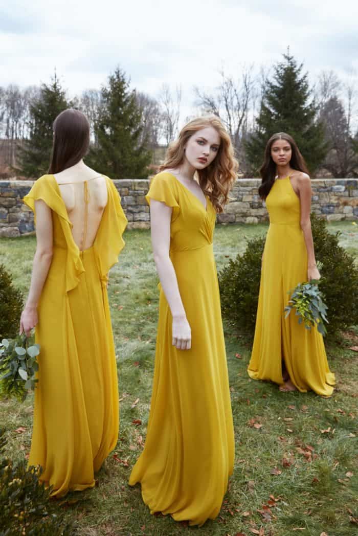 Yellow bridesmaid dresses with flutter sleeves by Jenny Yoo