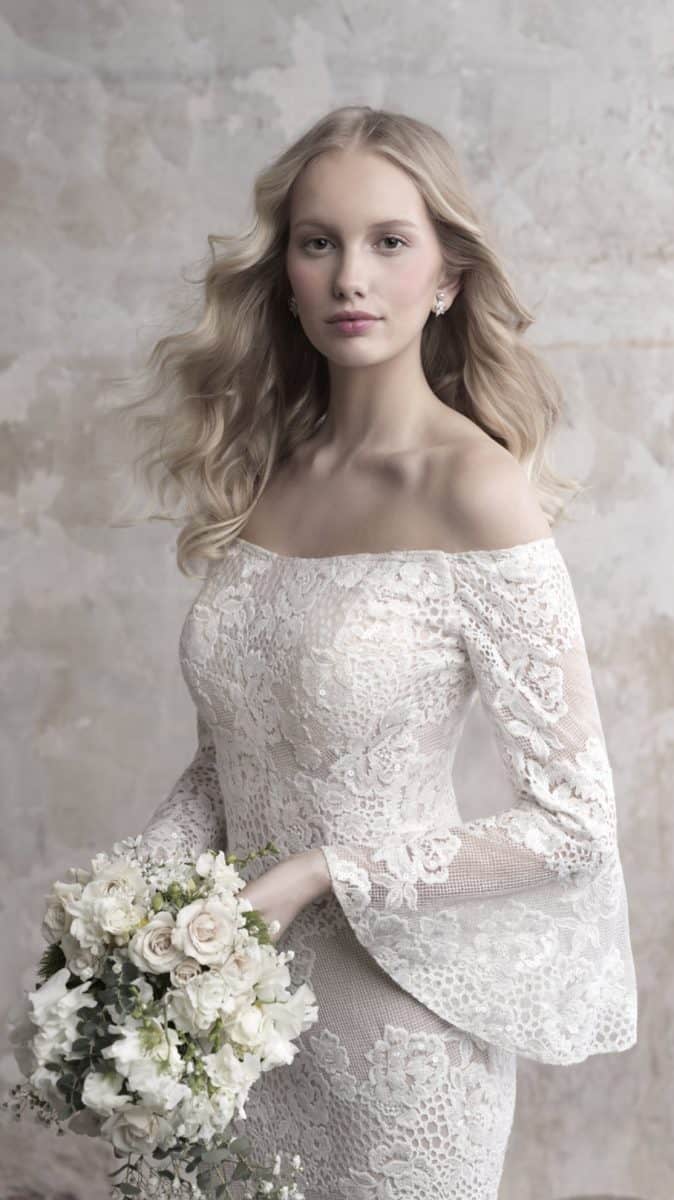 Madison James wedding dress with off the shoulder neckline and long bell sleeves