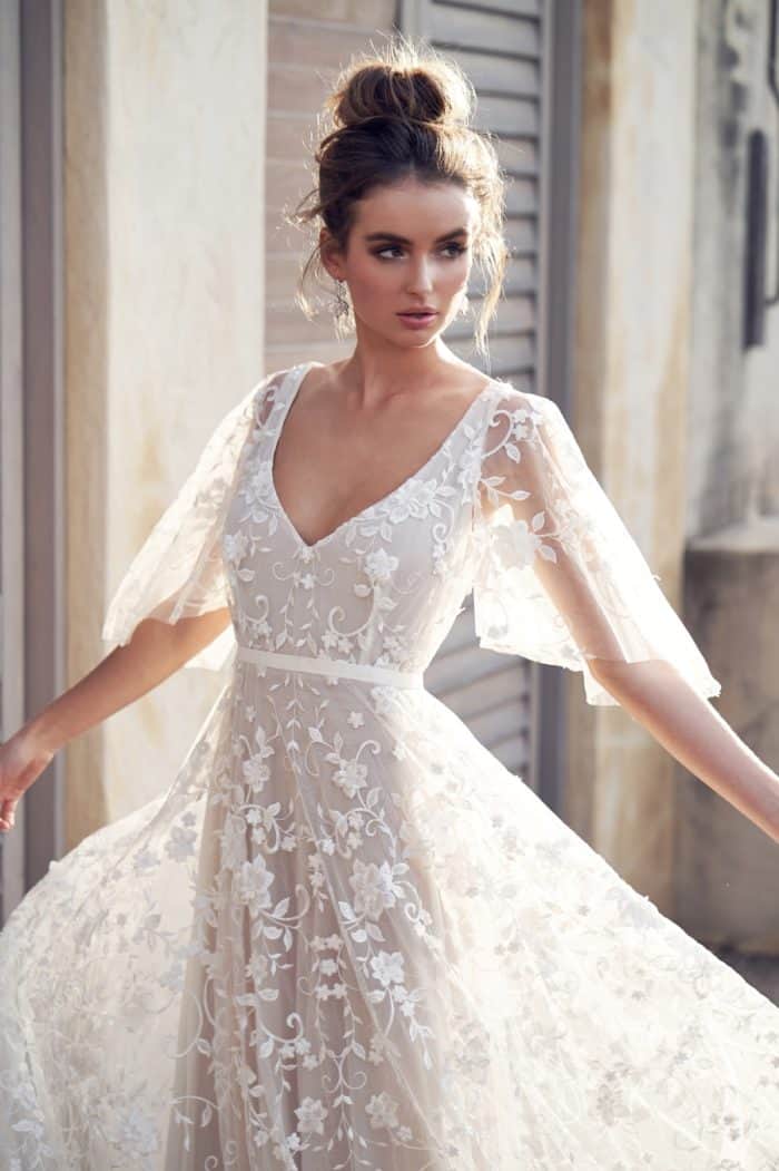 Sheer draped sleeve bridal gown by Anna Campbell