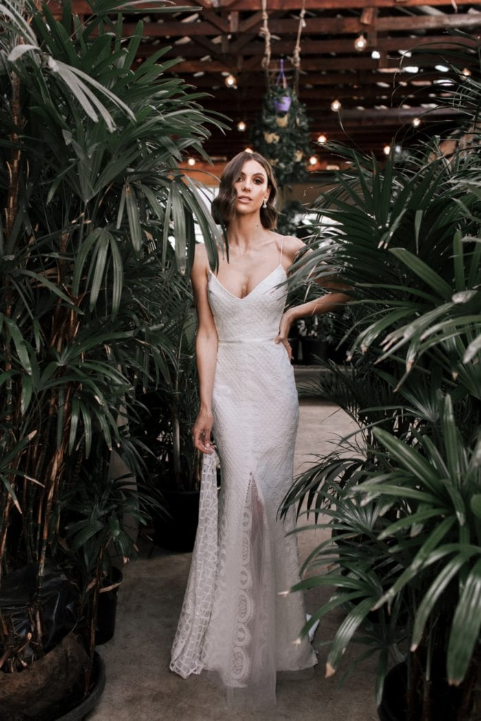Lace wedding dress with center slit skirt |