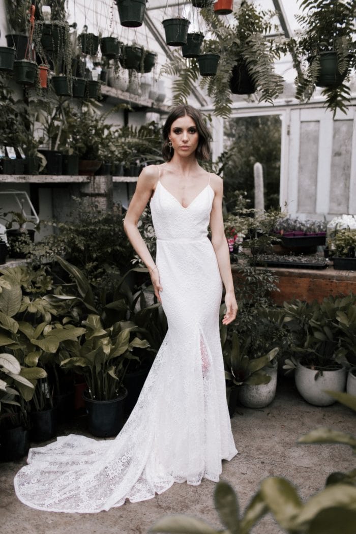 Justine is lace overlay spaghetti strap wedding dress.