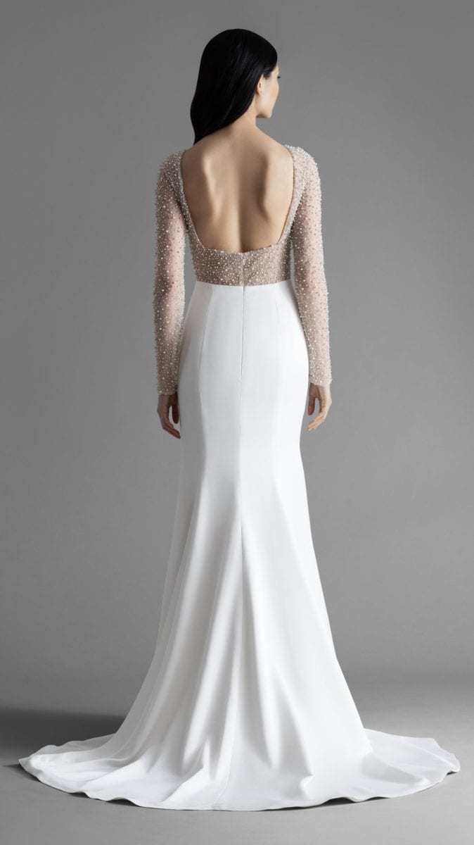 Back detail of Alexa gown by Allison Webb. Long sleeve modern wedding dress with embellished sleeves and bodice