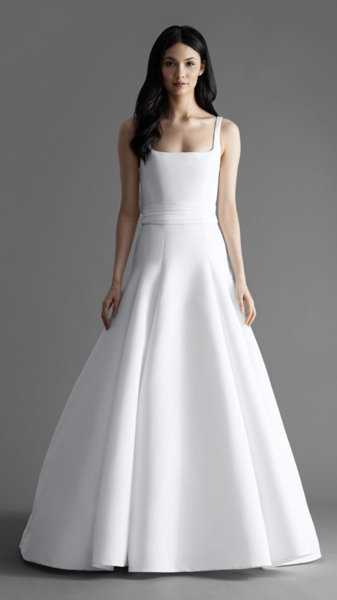 Easton is a curved square neck wedding dress with wide straps and optional bow