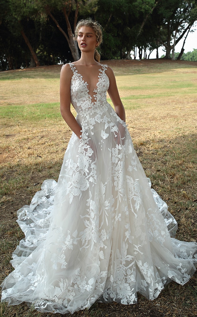 Sheer lace v neck bridal gown with pockets