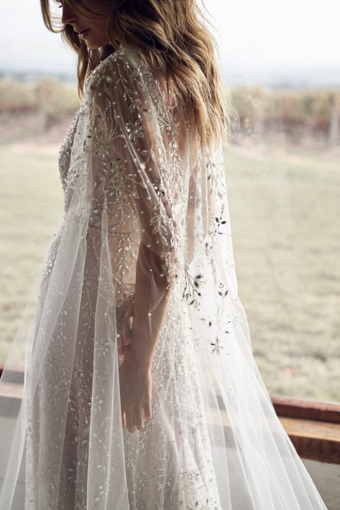 Beaded cape bridal gown