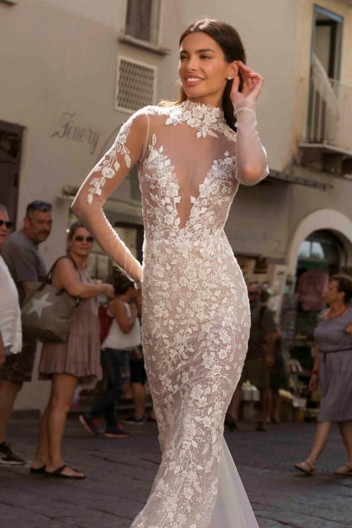 Sheer lace high neck designer bridal gown withlong sleeves