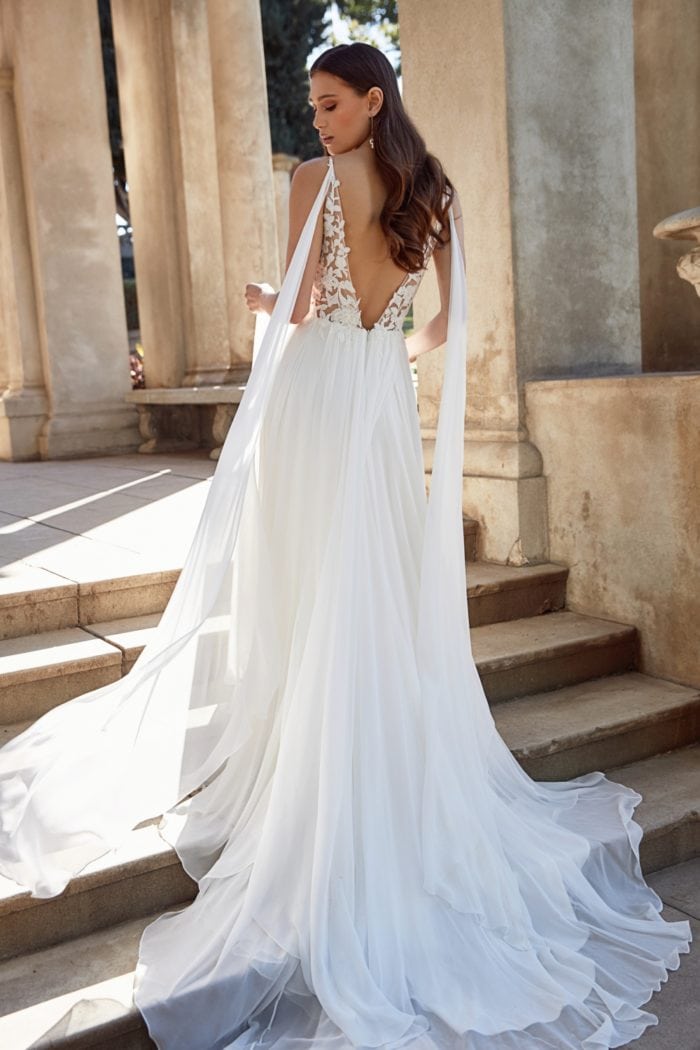 Wedding dress with shoulder streamers by Jenny Yoo