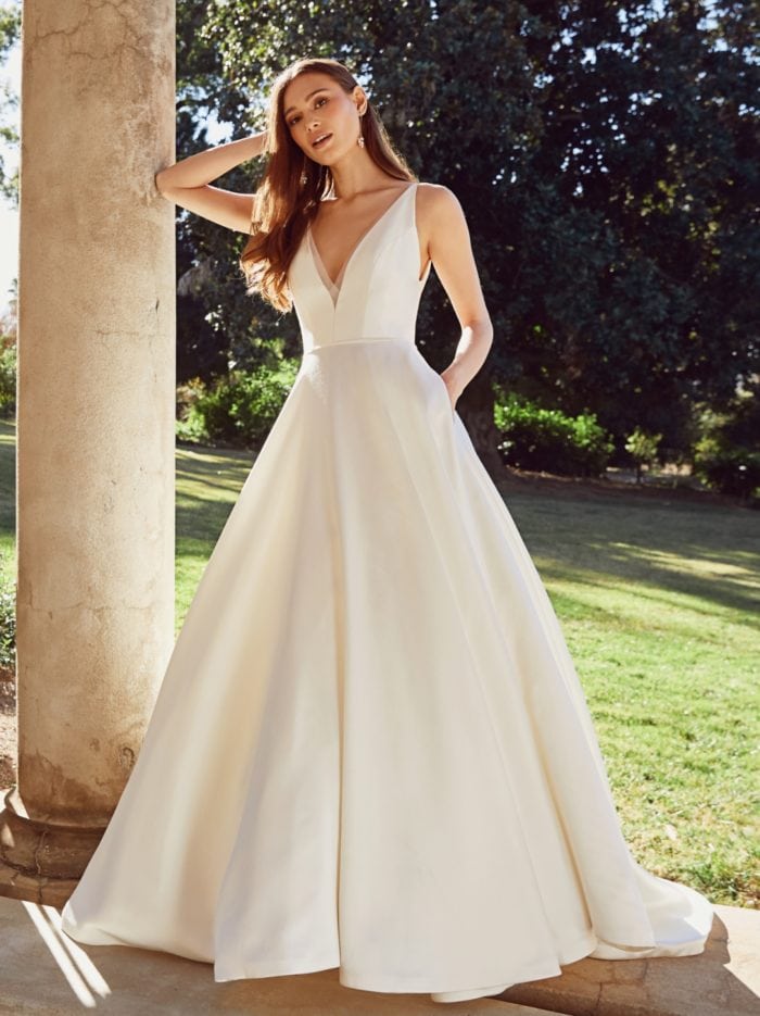 Modern ball gown wedding dress with V neck and pockets