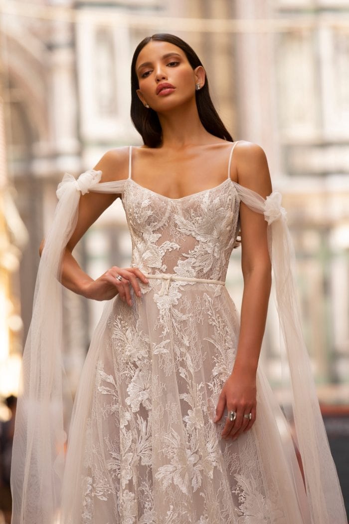 Romantic lace bridal gown with shoulder streamers