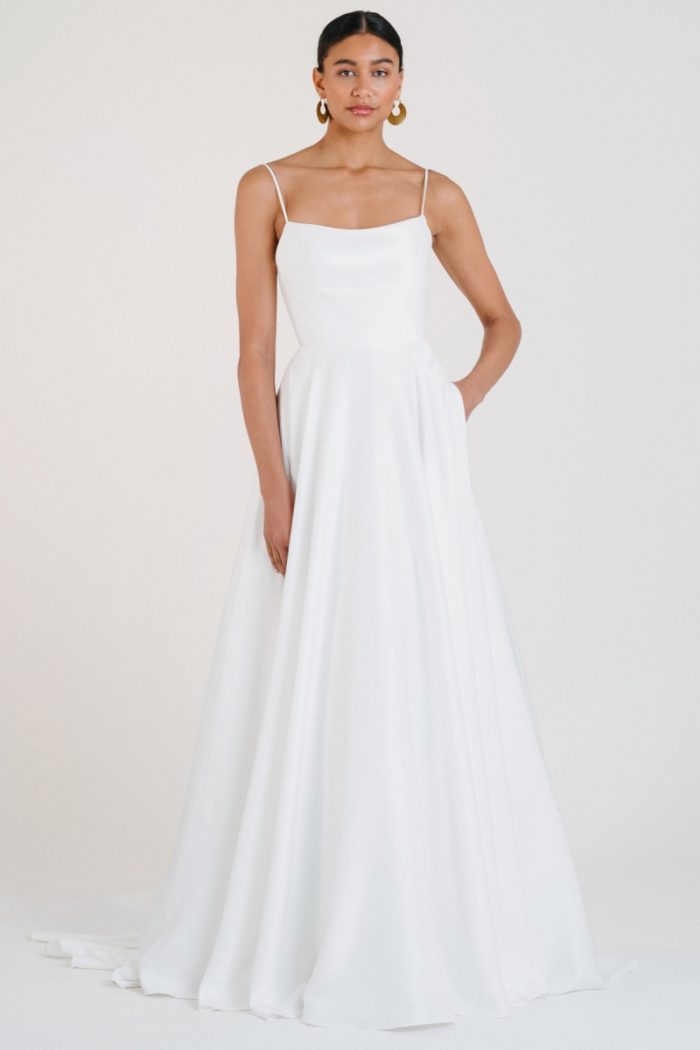 Ball gown wedding dress with spaghetti straps and pockets