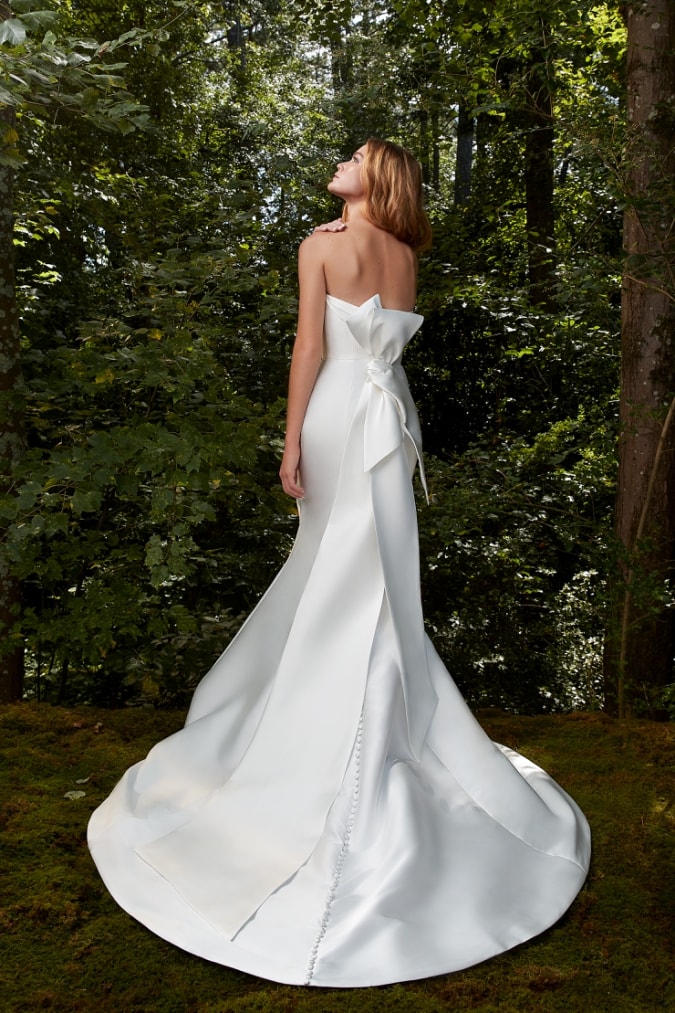 A bow back strapless wedding dress by Anne Barge