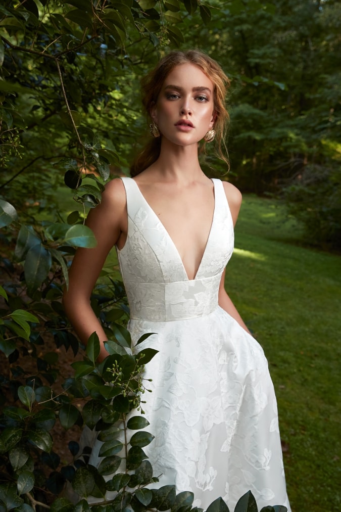 Wedding dress with pockets and and plunging square v neckine