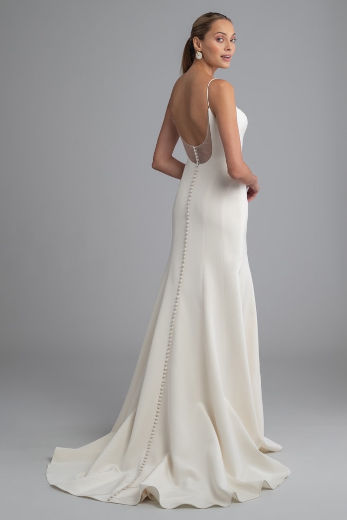 Sheer back detail and buttons ivory wedding dress Eva
