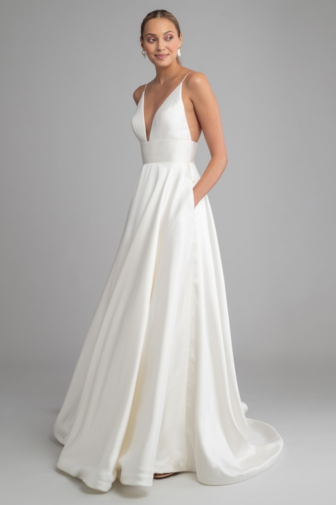 Ballgown wedding dress with spaghetti straps deep v and pockets