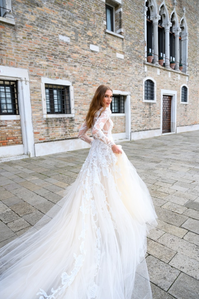 Long sleeve lace and tulletiered ballgown