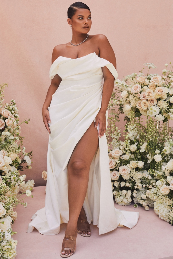 Plus size bridal gown with draped corset off the shoulder