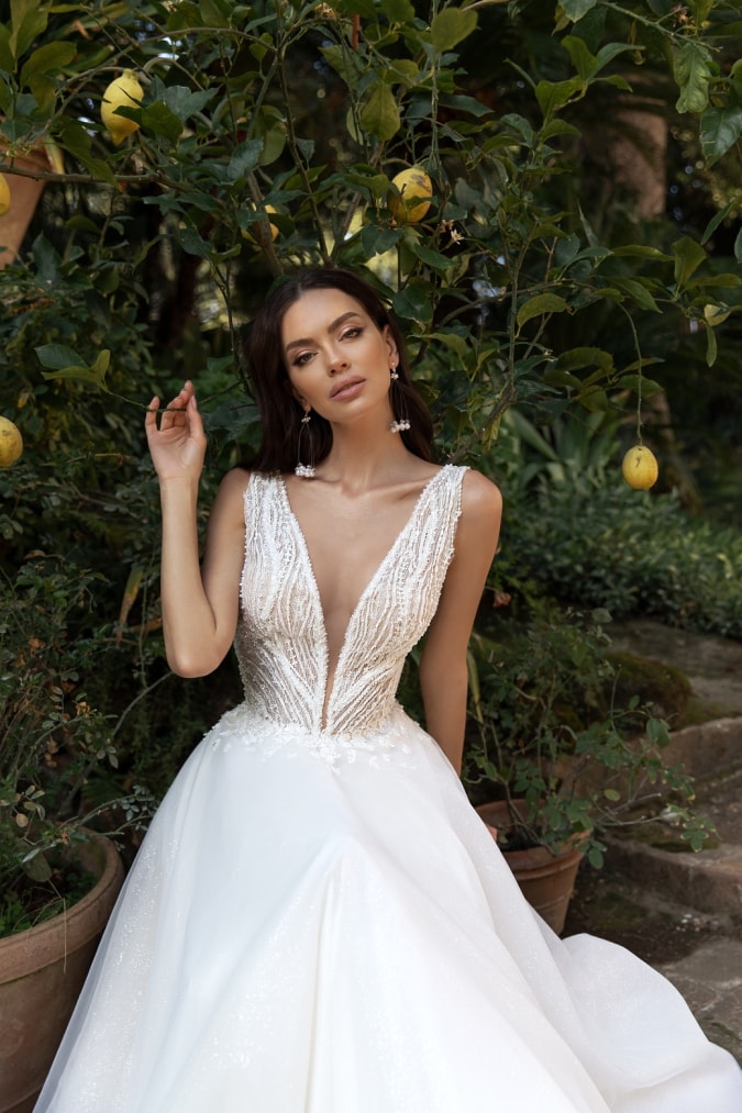 Model in a v neck bridal gown