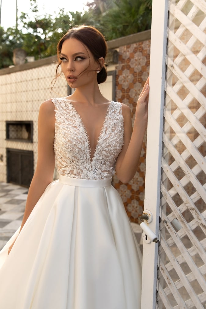 Model in a v neck wedding dress