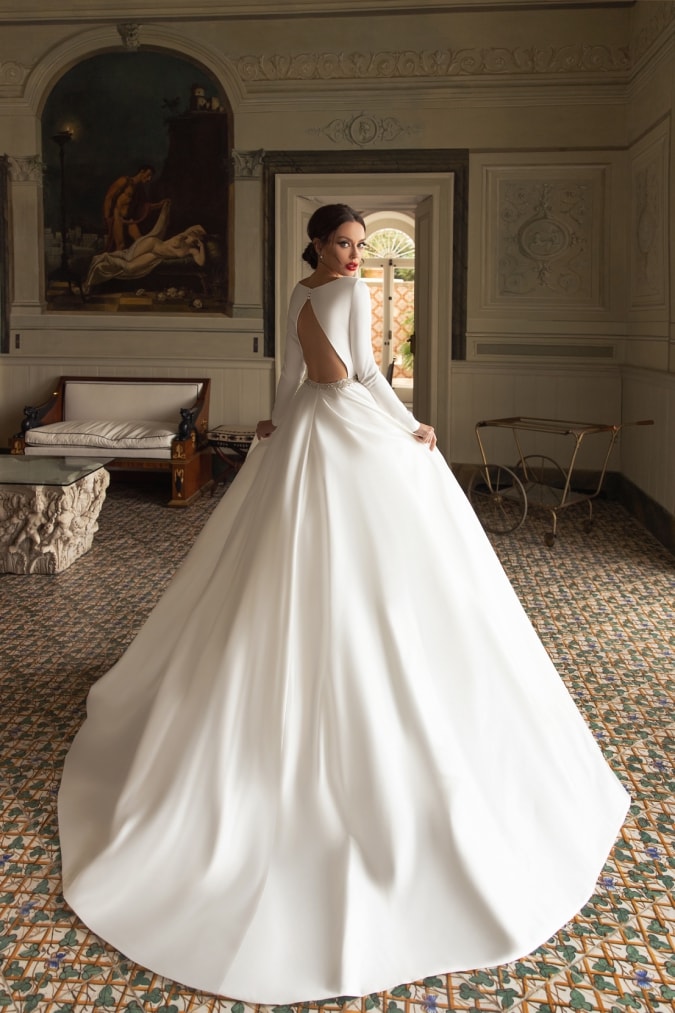 Ivory ball gown with keyhole back and long sleeves