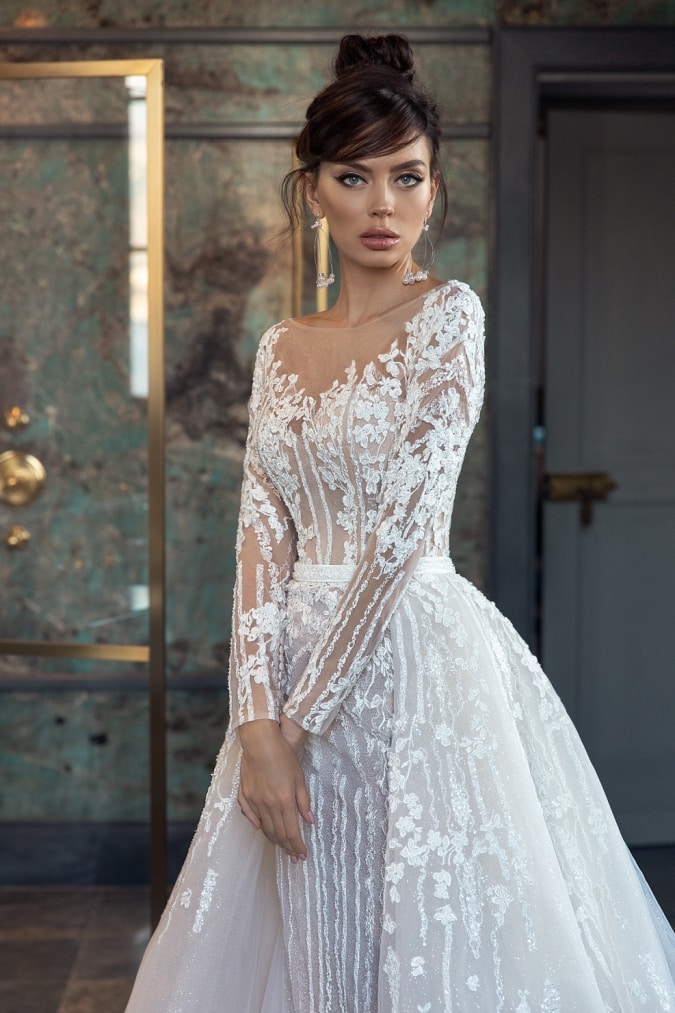 Long sleeve lace wedding dress with overskirt