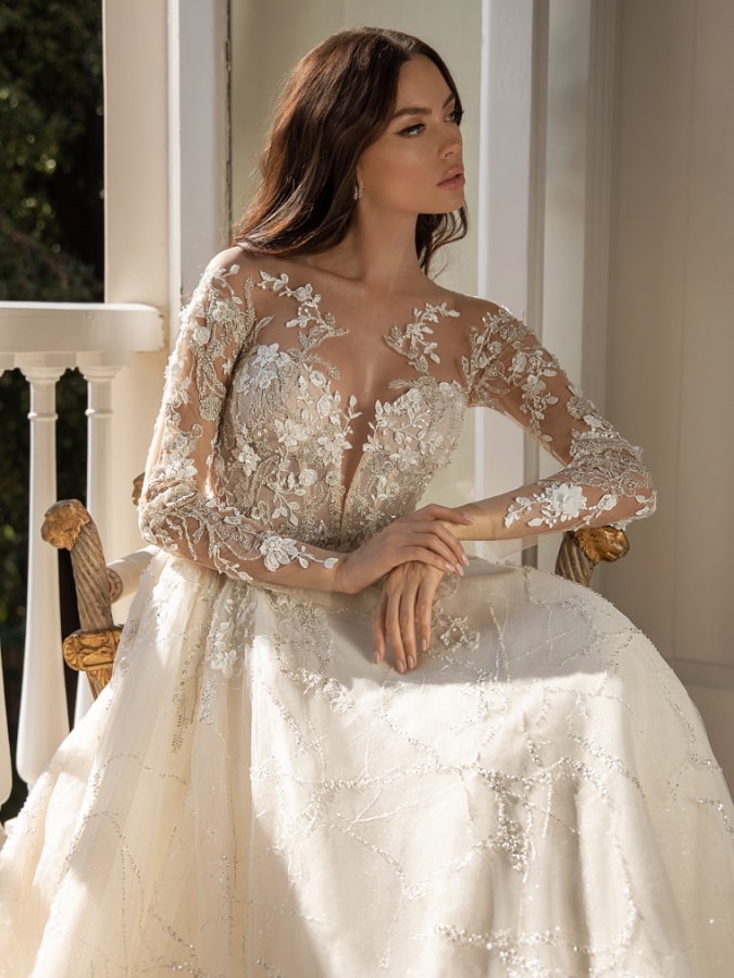 Embellished long sleeve wedding dress with illusion detail and plunge neckline