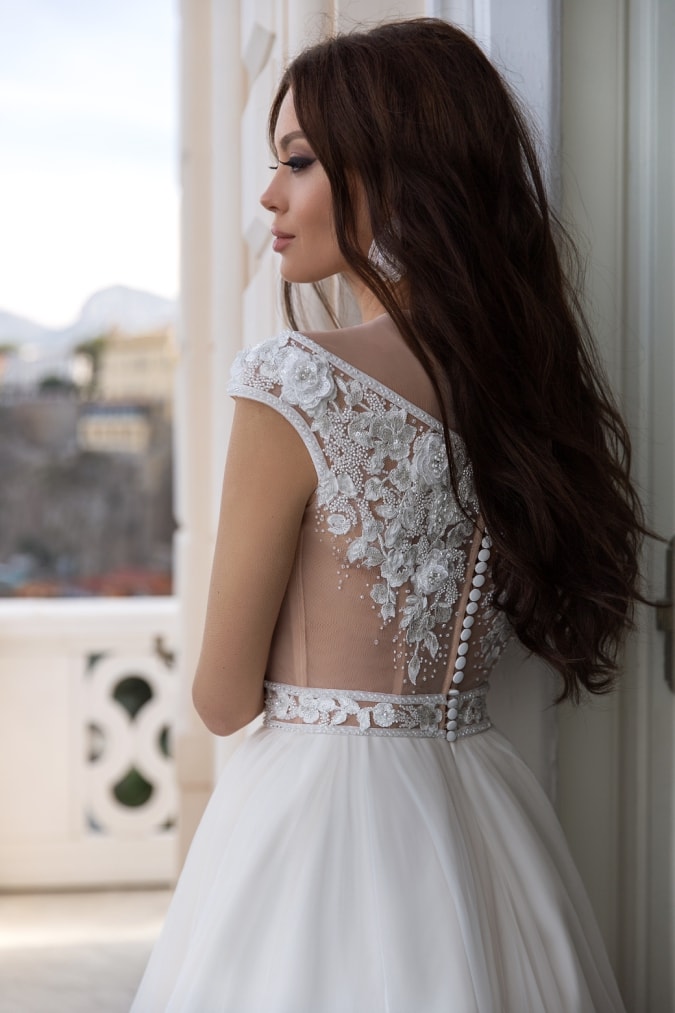 Illusion bodice wedding dress with beaded details and buttons