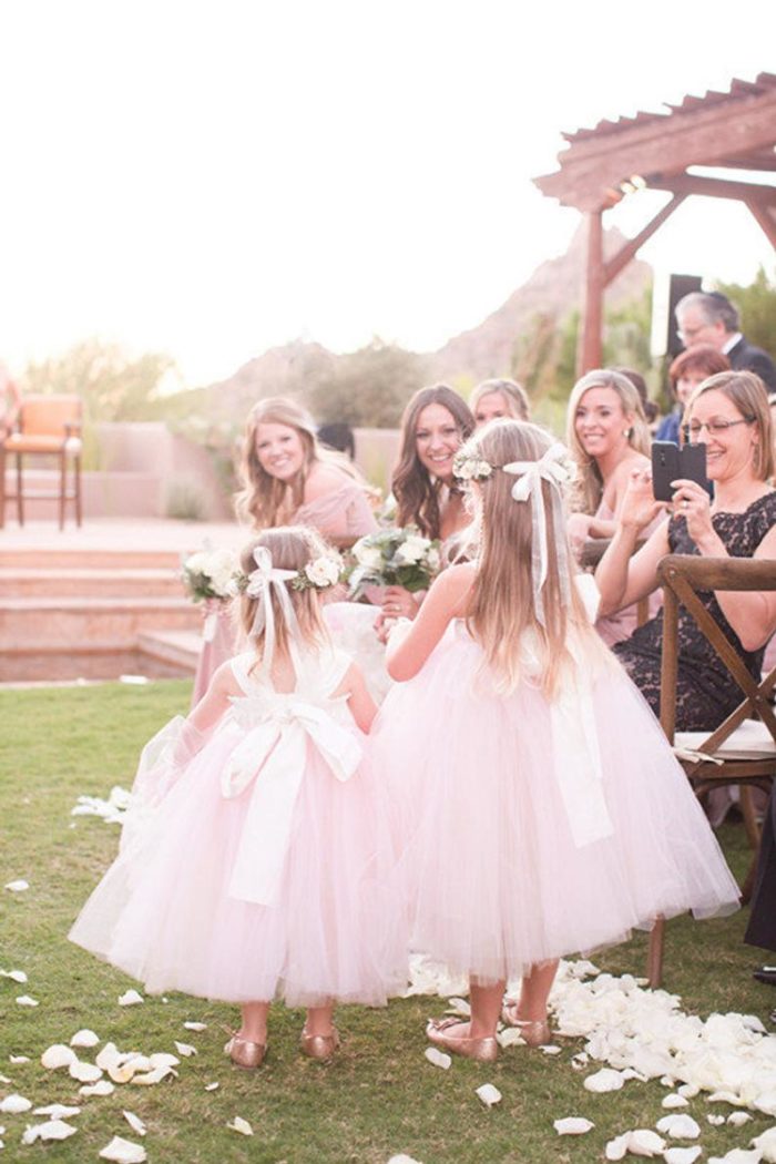 Two flower girls in pink tulle dresses