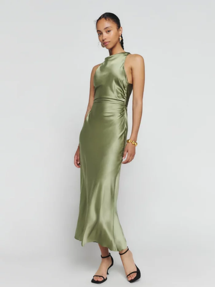 sustainably made pale green satin gown shown on model 