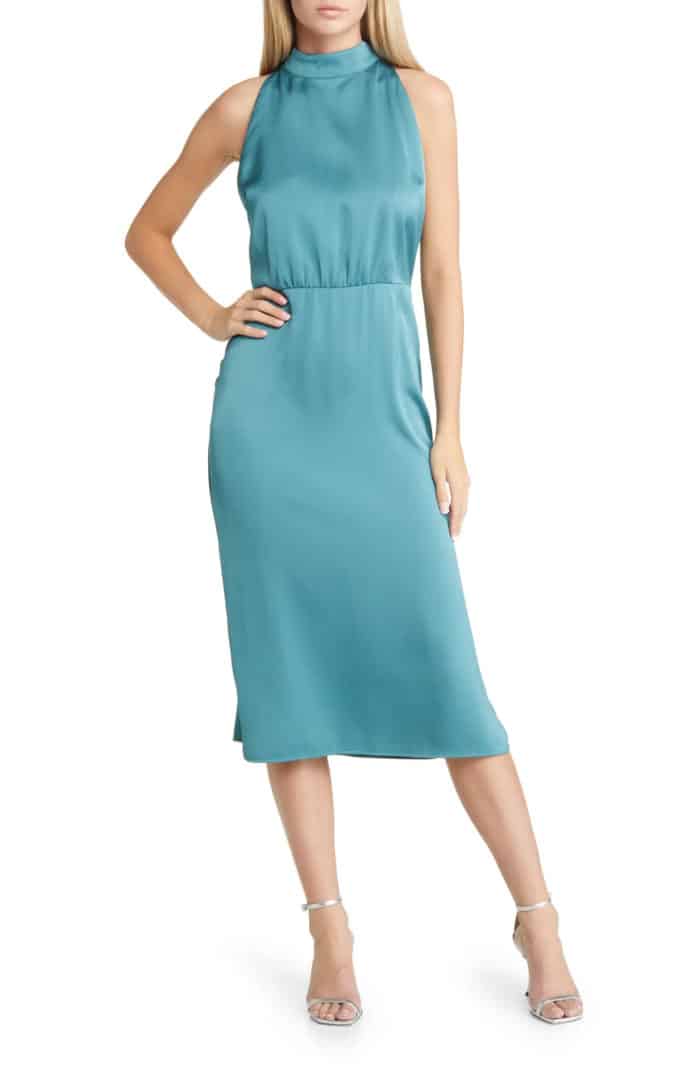 Sleeveless high neck blue green satin midi dress shown on a model