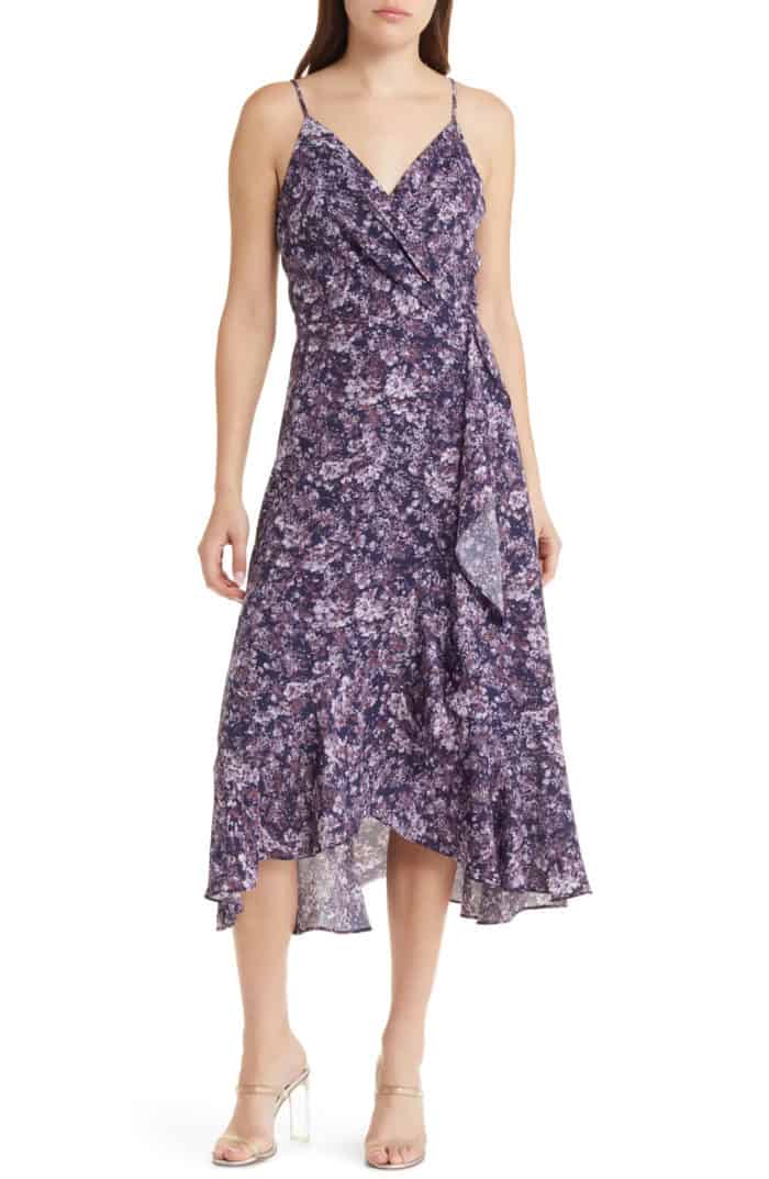 Spaghetti strap purple floral wrap dress product shown on model