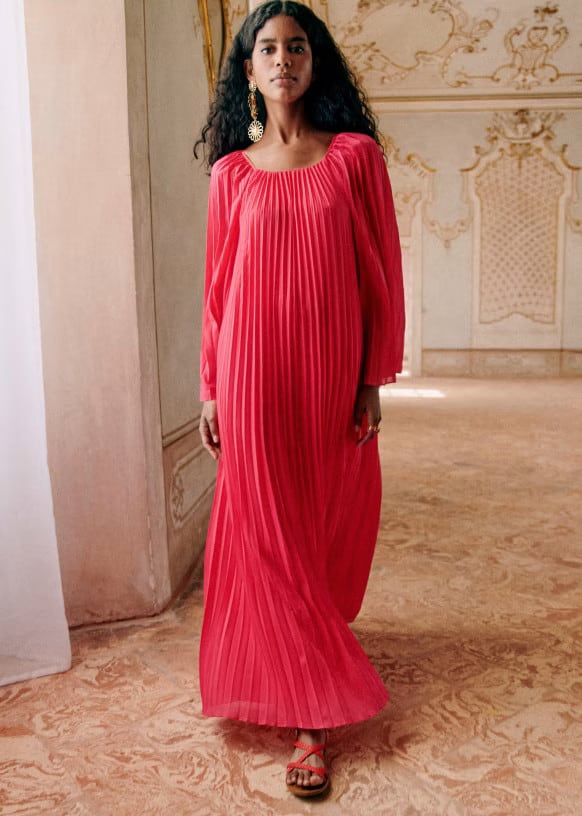 Pleated long dress with long sleeves shown on model