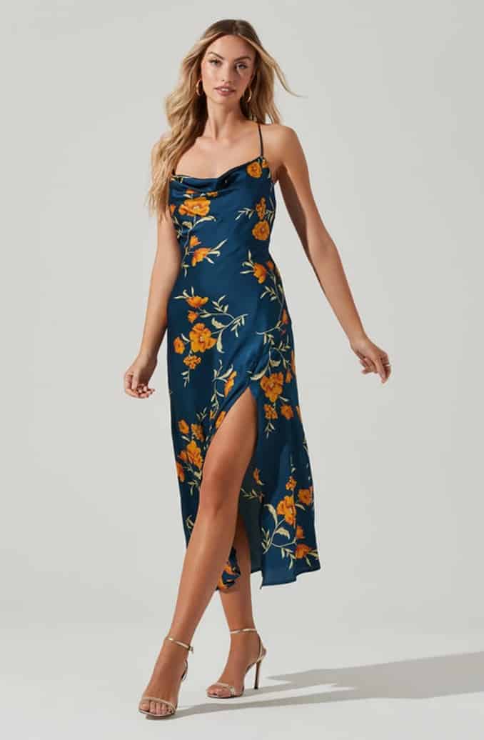 Blue midi slip dress with flowers shown on model