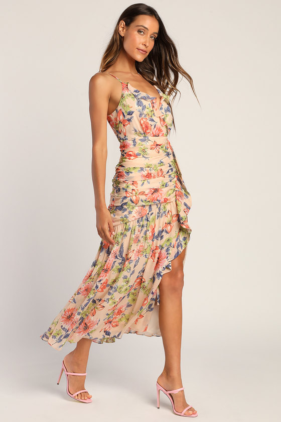 Neutral floral ruched cocktail dress shown on a model