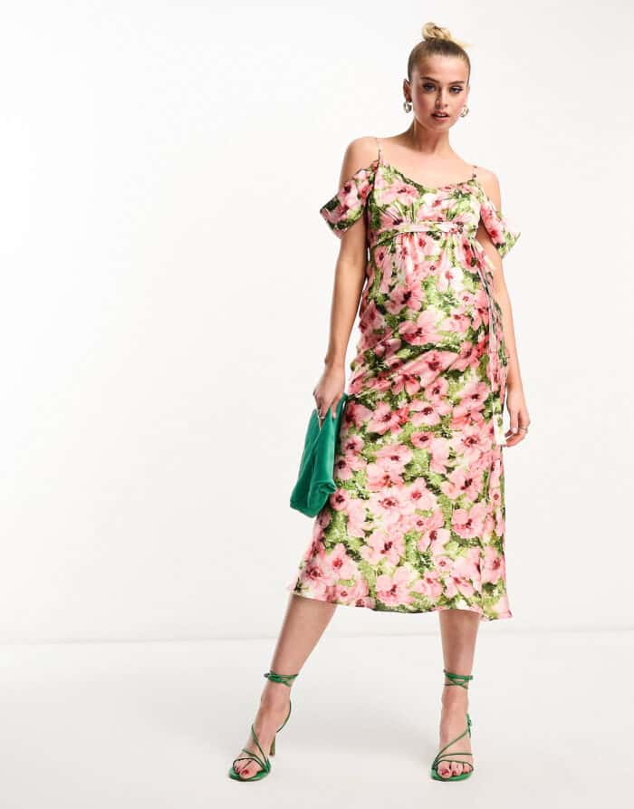 pink and green floral off the shoulder dress shown on a model