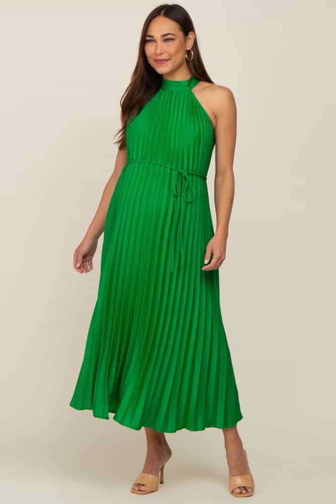 Green pleated maternity dress shown on model