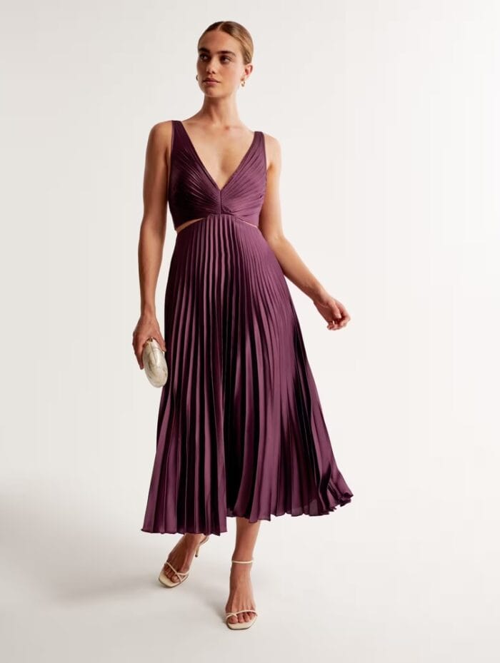 Pleated sleeveless plum midi dress shown on model