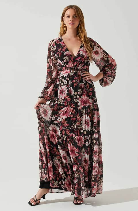 Long sleeve black floral maxi wrap dress with pink flowers shown on a model