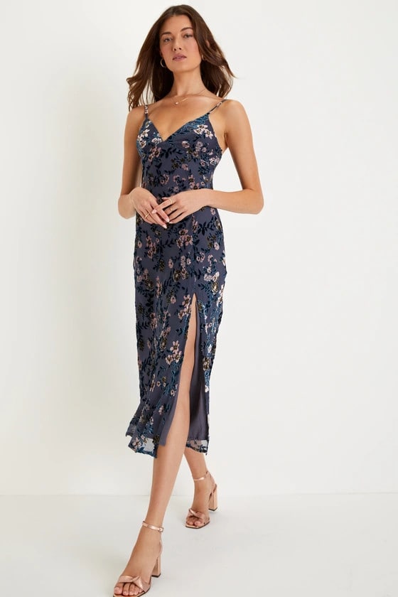 model wearing a blue spaghetti strap midi dress