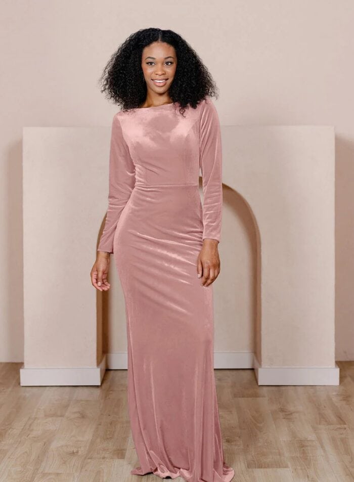 model wearing pink long sleeve velvet dress