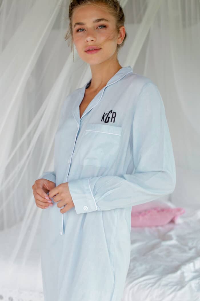 Model wearing a blue sleepshirt with monogram